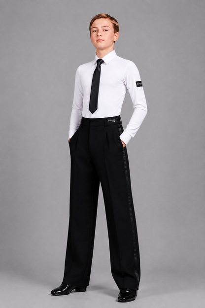 Boy wearing a white Standard Ballroom dance shirt with black tie and black competition trousers featuring satin side stripes, designed for youth ballroom competitions.