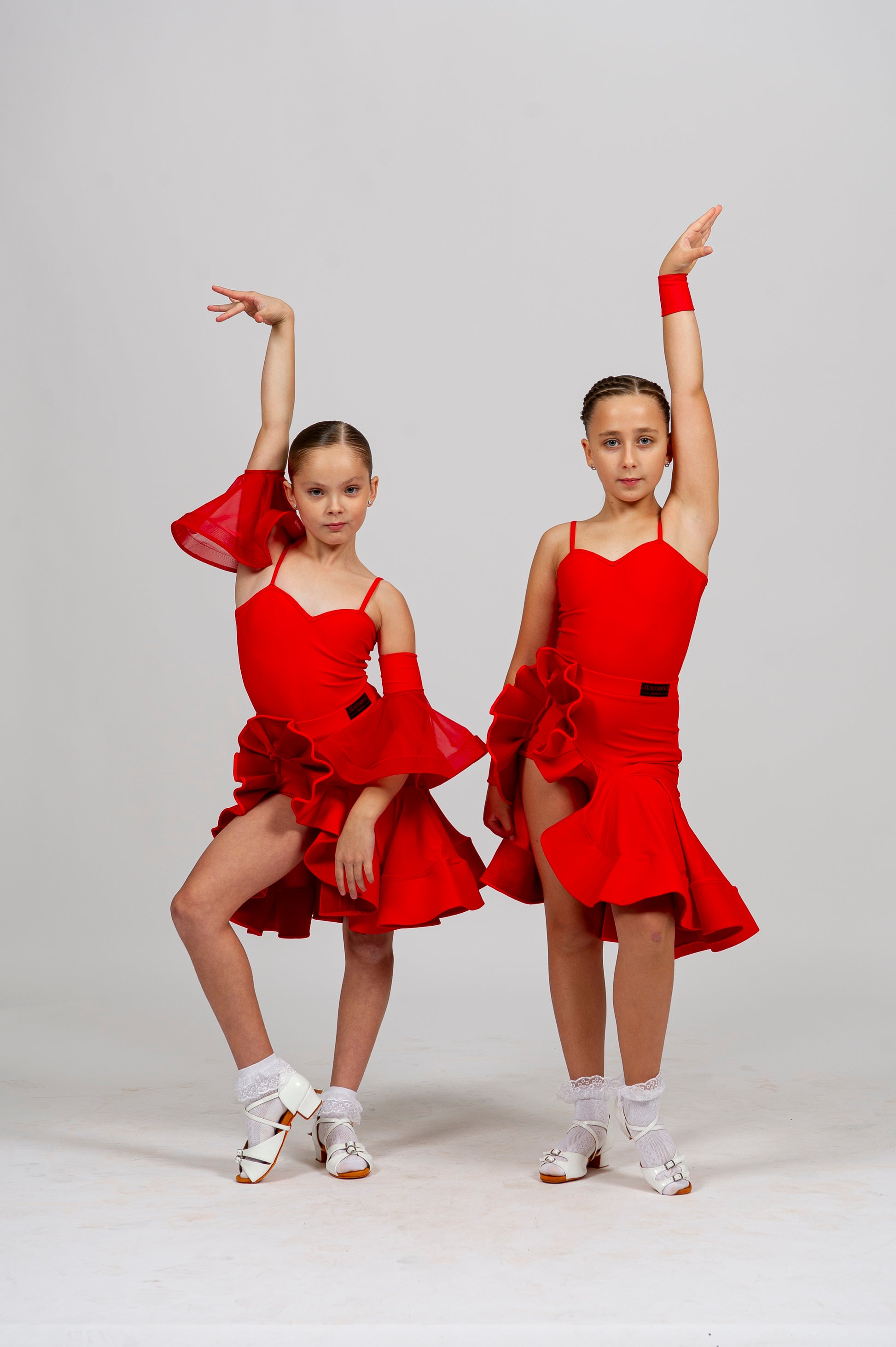 This beautiful red dance dress for girls is designed especially for young dancers and beginners.
The cut is modest and age-appropriate — not open or sexy — while still looking elegant and eye-catching on the dance floor.