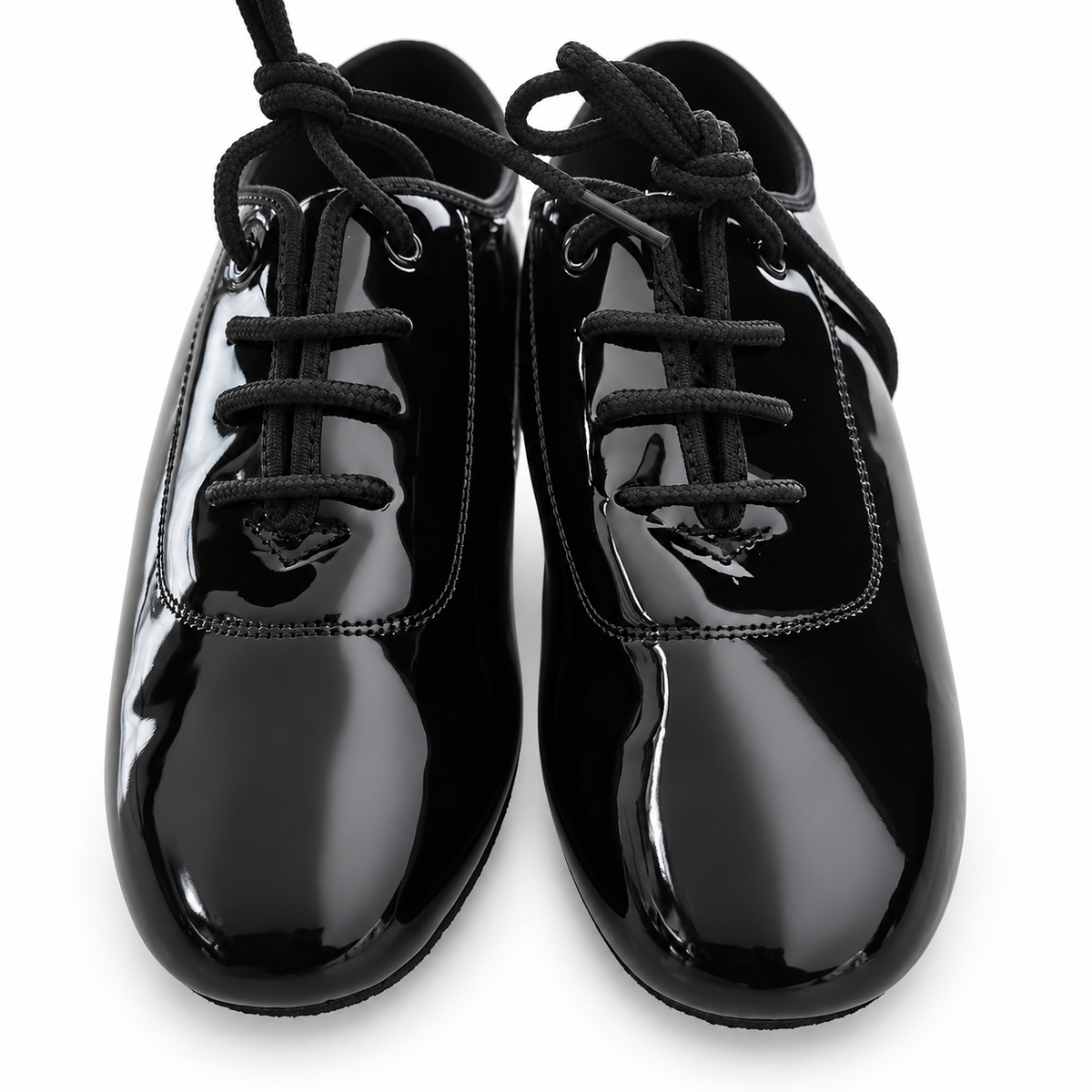 Black patent lace-up ballroom dance shoes for Juvenile boys on a white background.