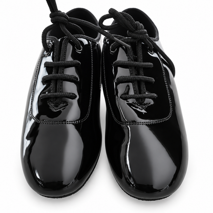 Black patent lace-up ballroom dance shoes for Juvenile boys on a white background.