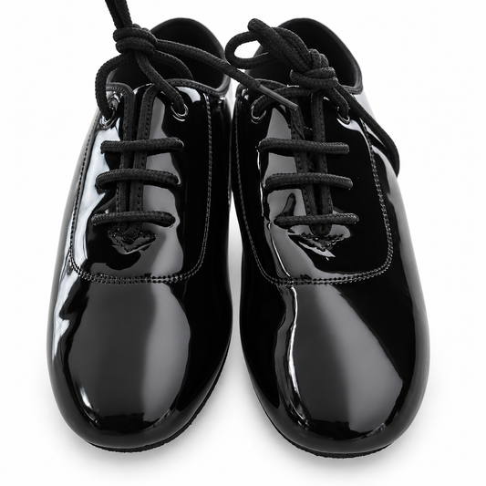 Black patent lace-up ballroom dance shoes for Juvenile boys on a white background.
