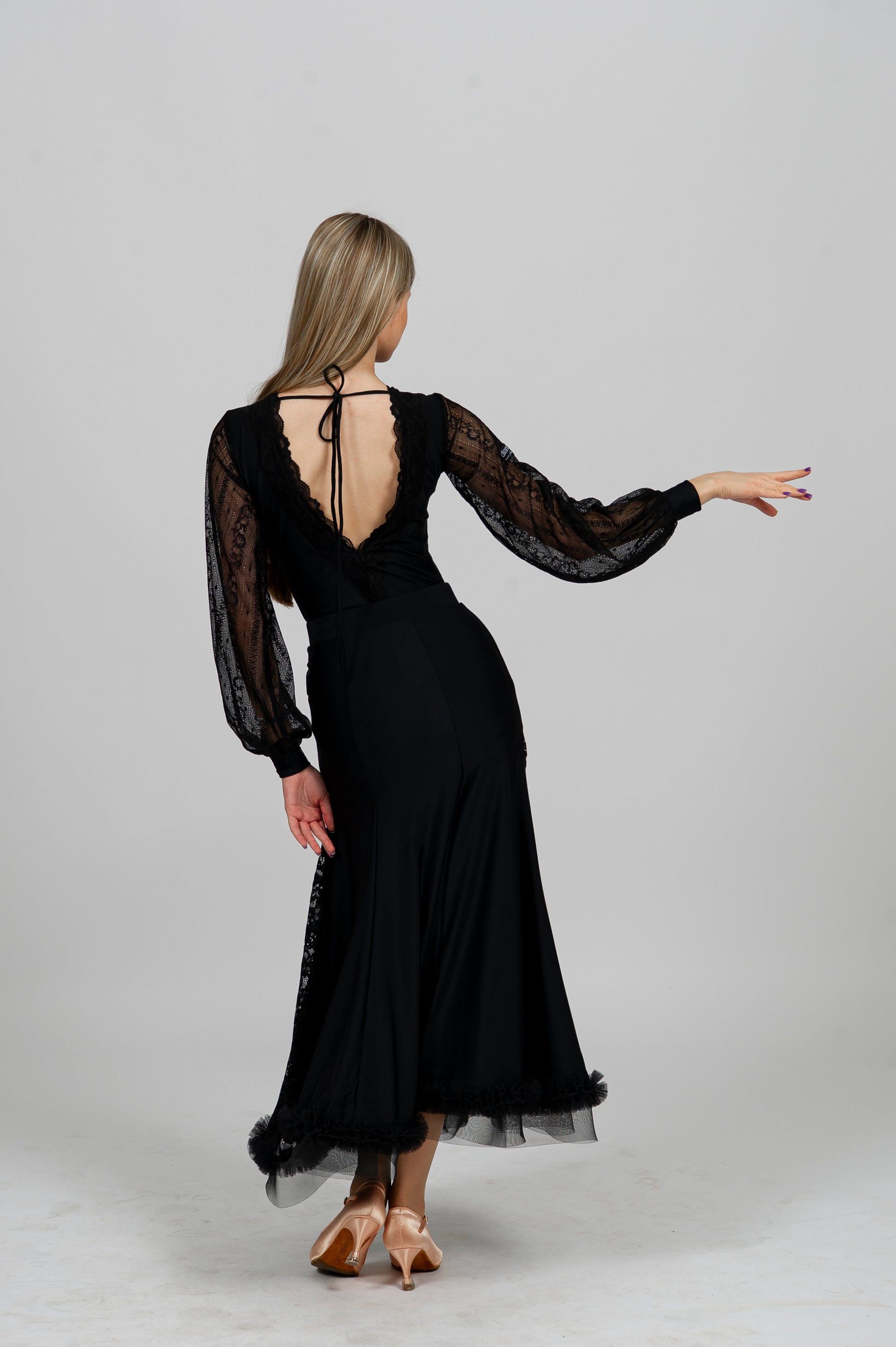 Elegant black Latin dance bodysuit with lace sleeves and deep open back — ideal for ballroom and Latin dance performance.