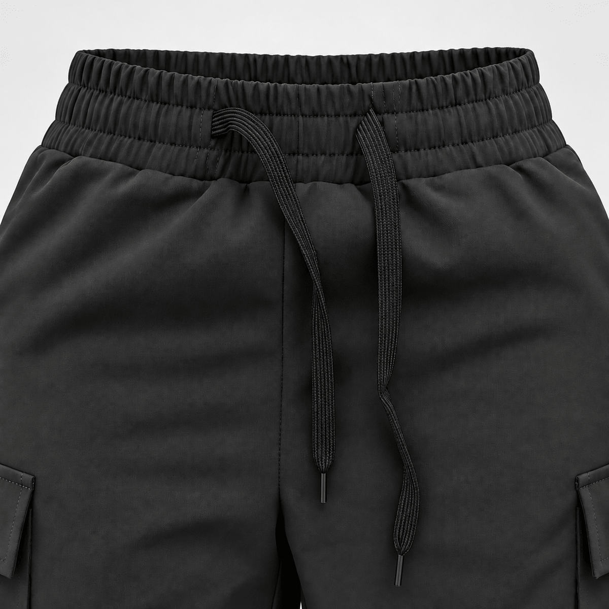 Close-up of Diamond Fashion black dance trousers showing the elasticated waistband, adjustable drawstring and side pockets.