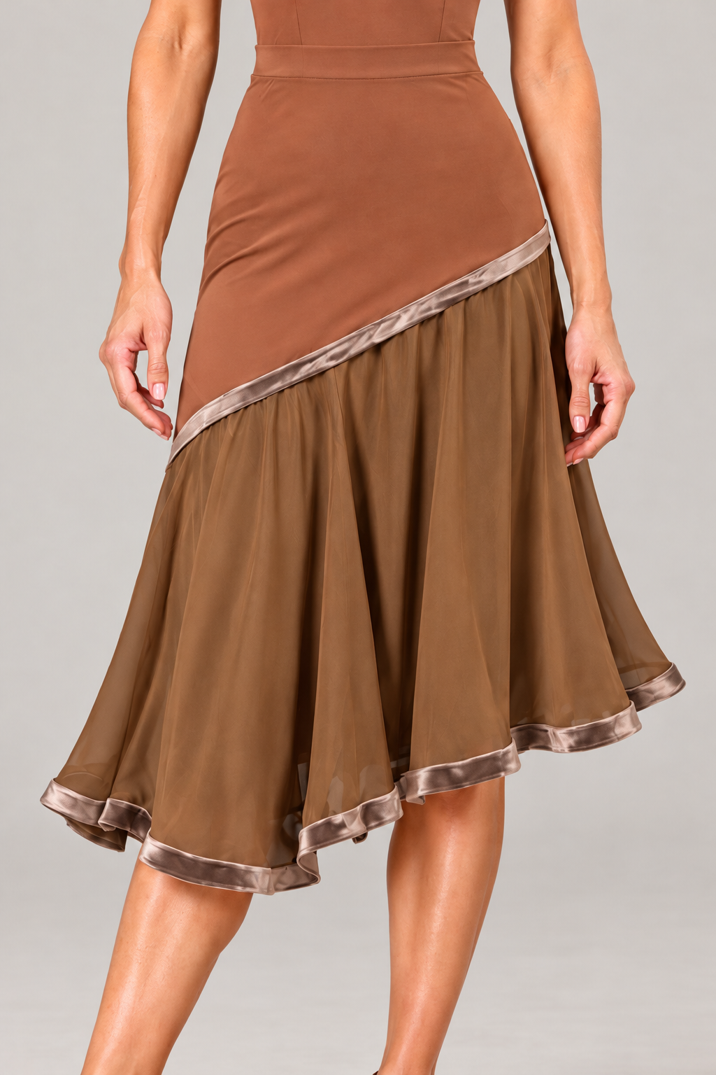 Close-up of a brown dance practice skirt with taupe velvet trim, a fitted upper section and a flowing lined midi skirt