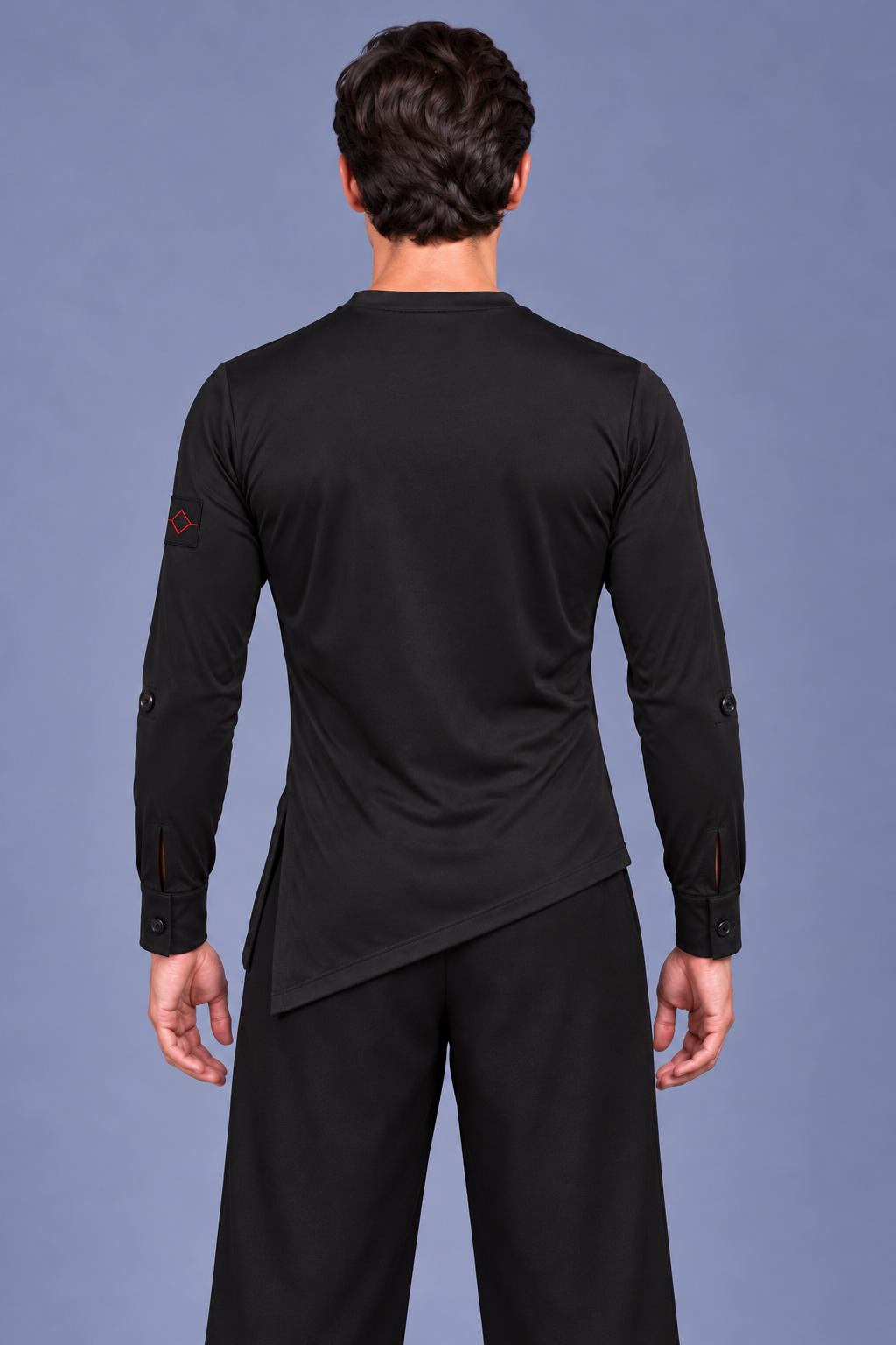 Back view of a man wearing the Diamond Fashion black stretch dance top with an asymmetric hem and long sleeves.