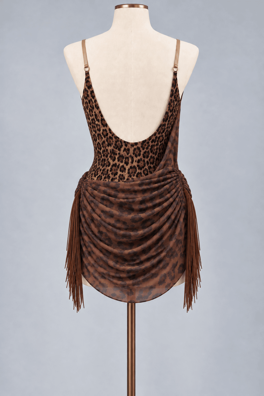 Brown Latin dance practice dress with fringe, showcasing a leopard print design and flowing skirt.