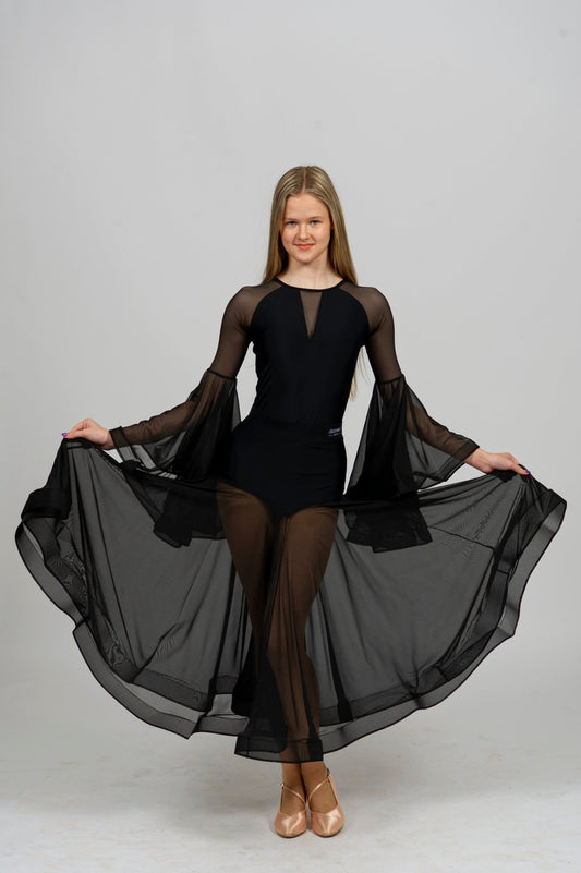 Elegant dancer in a black dance bodysuit with flowing sleeves and a sheer skirt, showcasing movement and grace.